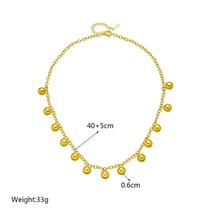 Minimalist gold titanium steel necklace with eleven spherical beads and adjustable chain