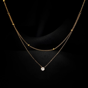 Exquisite double-layer titanium steel necklace with gold beads and a single zircon pendant