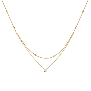 Double layered gold titanium steel necklace featuring a single zircon pendant and bead chain