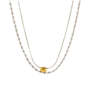 Dual-layer stainless steel necklace featuring golden barrel bead and silver oval beads