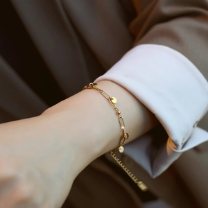 Minimalist 18K gold plated titanium bracelet with polished circular discs for women