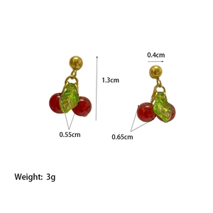 Red cherry earrings with green leaf charms and dimensions marking on white background