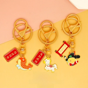 Detail view of traditional Chinese style enamel keychains with good luck charm designs