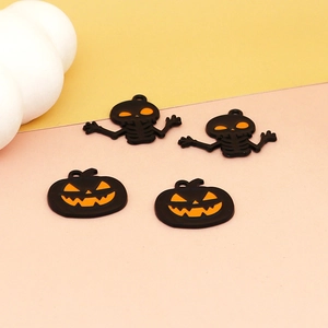 Detailed view of Halloween DIY enamel charms featuring black skeleton and pumpkin designs