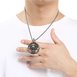 Vintage titanium steel skull engine pendant necklace for men worn on a male model detail