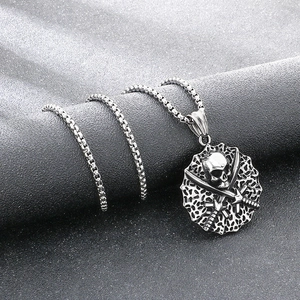 Detail view of a vintage titanium steel skull and crossbones pirate pendant necklace