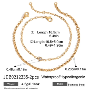 Gold-plated stainless steel double-layer bracelet set featuring a single sparkling rhinestone