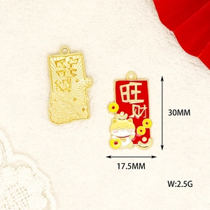 Detail view of red and gold Chinese New Year lucky cat pendants with precise 30mm dimensions