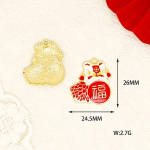 Detailed view of gold plated Chinese New Year dancing lion charm with red fortune character