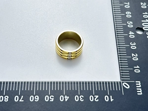 Macro shot showing 20mm outer diameter measurement of a 18K gold plated wide ring