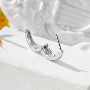 Minimalist geometric oval star 316L stainless steel hoop earring in an open position