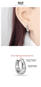 Detail of 316L titanium steel oval hoop earrings with star pattern and 10mm inner diameter.