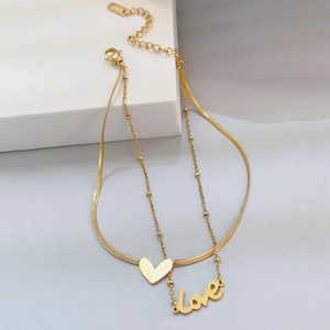Tobillera doble dorada con colgante de corazón y palabra Love en cadena de serpiente fina