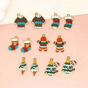 Collection of festive Christmas charms featuring sweaters, gingerbread men and raccoon trees