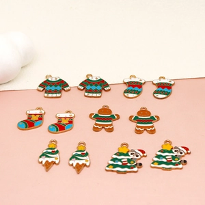 Variety of Christmas enamel charms including gingerbread man and sweaters