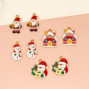 Close-up detail of colorful Christmas enamel charms featuring Santa, snowmen and houses
