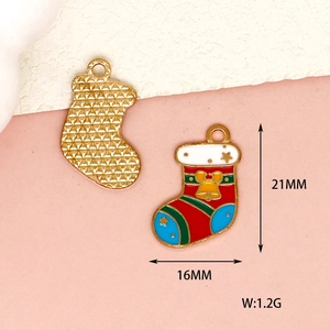 Detailed view of enameled Christmas stocking charms with dimensions 16mm x 21mm for DIY