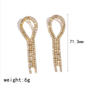 Elegant stainless steel tassel earrings with sparkling white rhinestones in gold finish