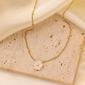 Elegant 18K gold plated titanium necklace with white shell flower pendant on beige silk