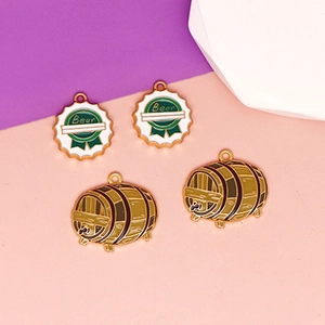 Detailed view of enamel beer barrel and bottle cap charms for DIY jewelry making crafts.