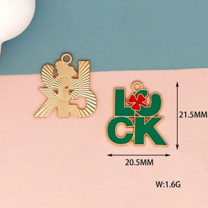 Macro view of green Luck shamrock charm pendant with dimensions and weight info