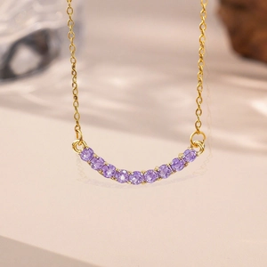 Elegant gold necklace with purple gemstone smile pendant and minimalist chain for women