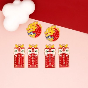 Detail of Chinese New Year charms featuring dragon and lion dance designs with festive scrolls.
