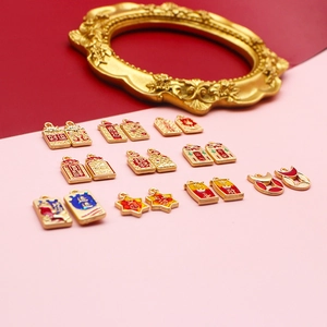 Detailed view of Chinese style golden charms with red enamel and lucky characters.