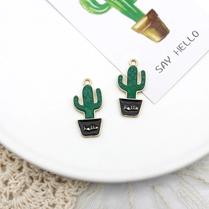 Detailed macro view of cute green cactus enamel charms for DIY handmade jewelry crafts