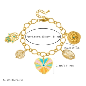 Gold stainless steel charm bracelet featuring evil eye heart and hamsa hand pendants