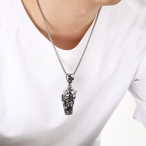 Detailed close-up view of a men's stainless steel Gothic demon mask pendant with box chain