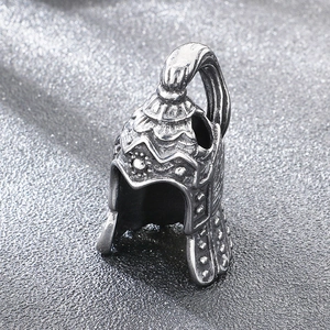 Detailed close-up of a vintage Viking warrior helmet pendant in stainless steel gothic style
