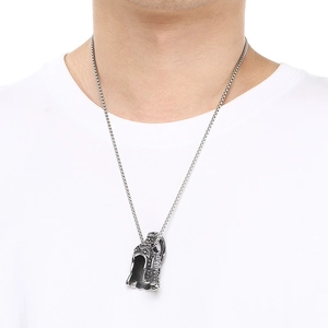 Detailed shot of Viking warrior helmet pendant on a stainless steel chain for men