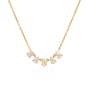 Detailed view of five sparkling clear teardrop-shaped zircons on a gold-plated chain