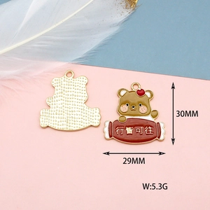 Detailed view of lucky cartoon bear enamel pendant charm showing 30mm x 29mm size dimensions