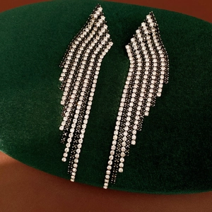 Vintage style silver needle rhinestone tassel earrings featuring a bold rhombus design