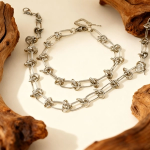 Vintage silver knot chain necklace with key pendant and lobster clasp in 45-degree view