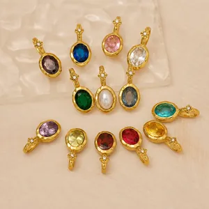 Collection of 12 birthstone pendants in oval cut gemstones with gold-plated star detail.