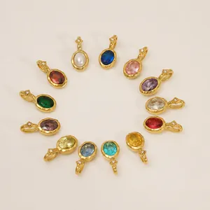 Detailed view of twelve colorful birthstone pendants in gold plated stainless steel finish
