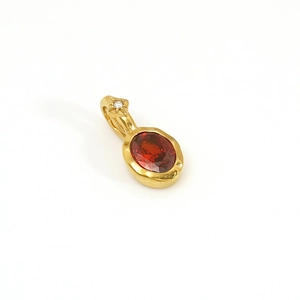 Elegant 14K gold plated stainless steel pendant with oval red garnet birthstone