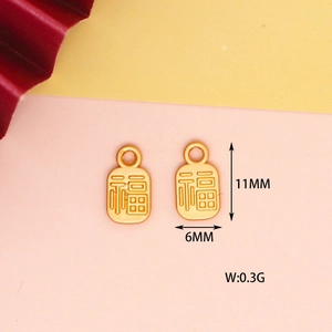 Dettagli dei ciondoli portafortuna 'Fu' dorati con dimensioni 11x6mm e peso 0,3g