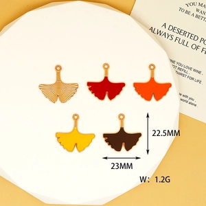 Detailed view of colorful ginkgo leaf enamel charms with 23mm size measurement