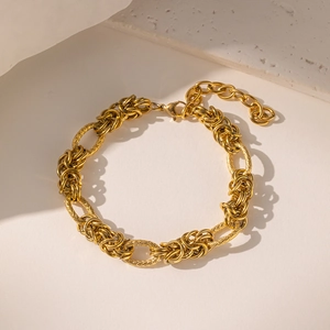 Chunky gold stainless steel link bracelet with textured oval rings and lobster clasp