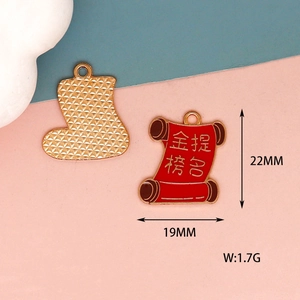 Detailed view of red alloy scroll charm with 22mm x 19mm measurement markers