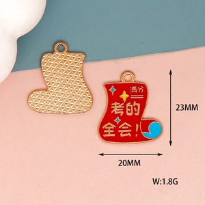 Detailed macro view of a red enamel boot charm with clear size markings for students