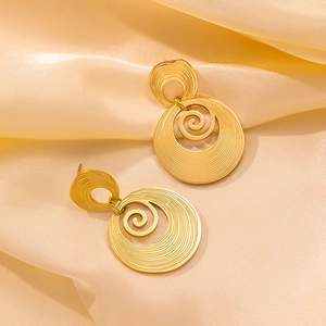 Minimalist 18k gold plated stainless steel textured hoop earrings on yellow silk fabric
