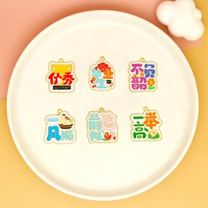 Macro view of various colorful alloy enamel charms with encouraging Chinese symbols