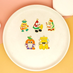 Macro view of colorful cartoon fruit enamel charms set for DIY jewelry making crafts