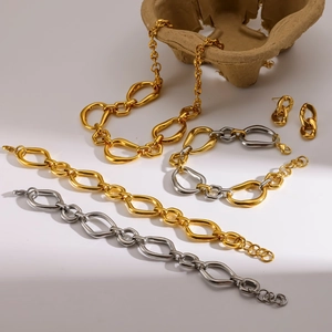 Chunky stainless steel jewelry set with irregular oval links in 18k gold and silver tones