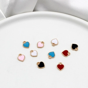 Colorful small heart-shaped alloy enamel pendants for DIY jewelry making and cute charms.